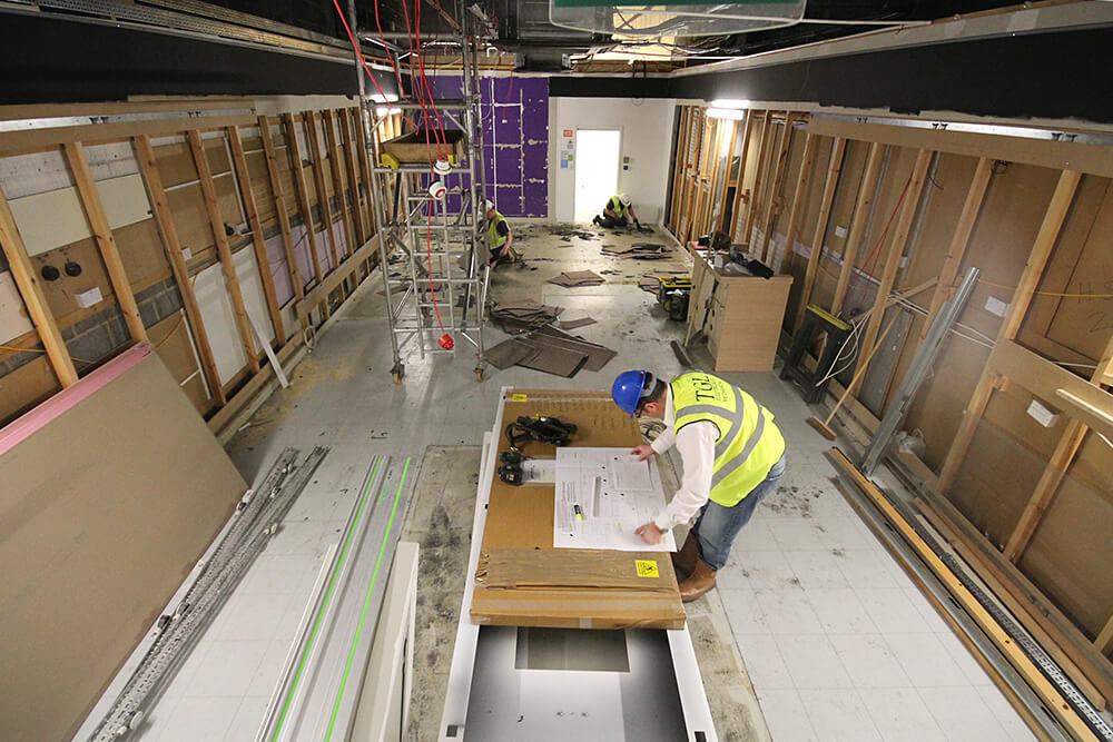 Workmen working on an internal fit-out for a retail shop