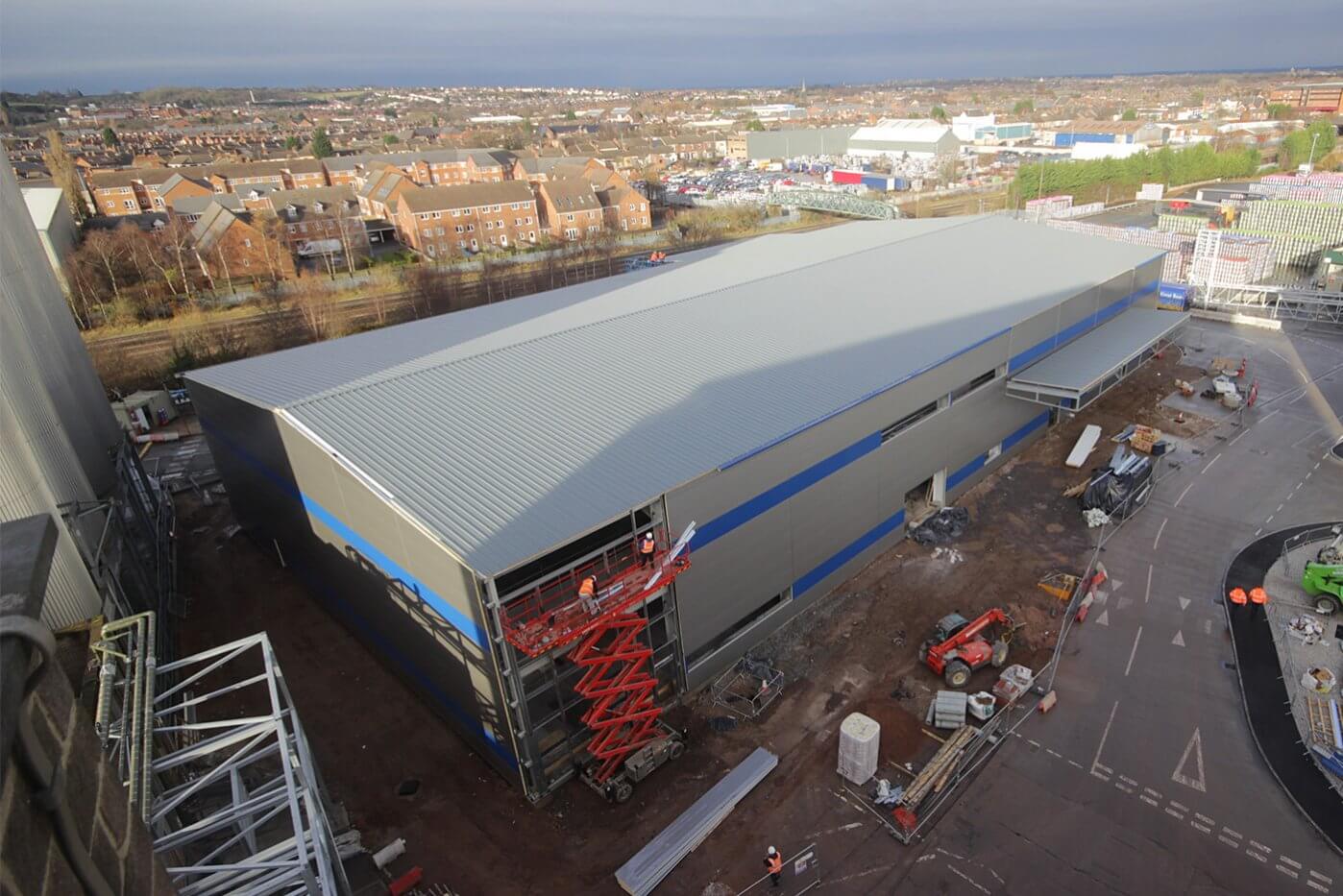 Aerial view over the construction of a new warehouse and brewing facility