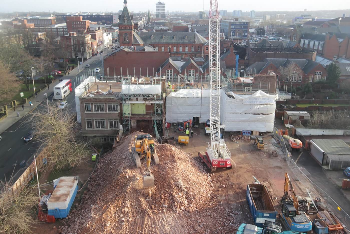 A former college in West Bromwich, West Midlands, being demolished using on-site plant