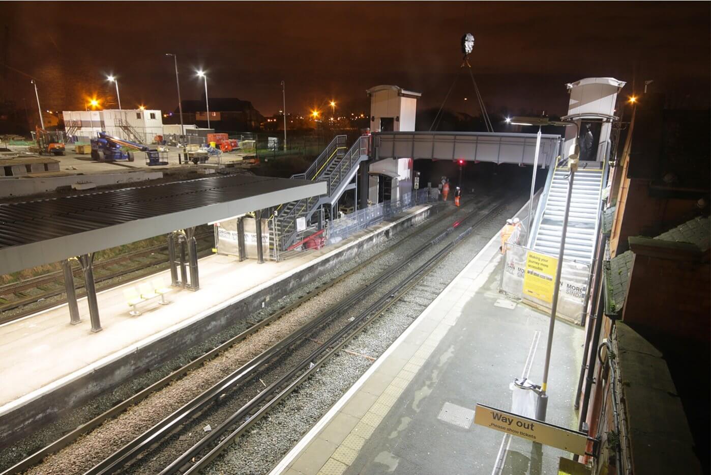 A new rail bridge being installed at a railway station